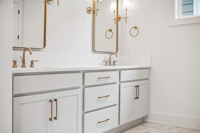 bathroom with double sink vanity and tile patterned flooring