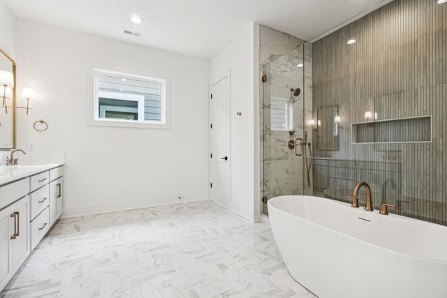 bathroom featuring vanity and independent shower and bath