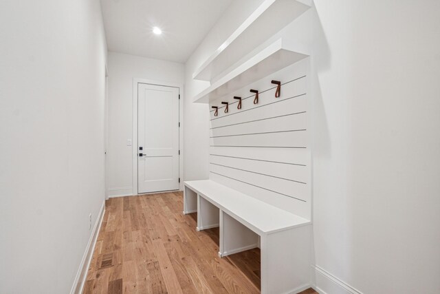 mudroom with light hardwood / wood-style floors