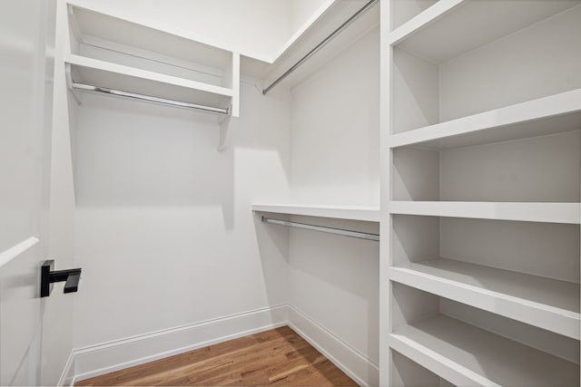 walk in closet featuring hardwood / wood-style floors