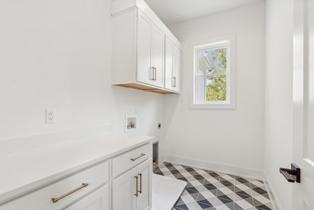 laundry area featuring cabinets, hookup for an electric dryer, and hookup for a washing machine