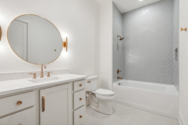 full bathroom featuring tiled shower / bath, toilet, tile patterned floors, and vanity