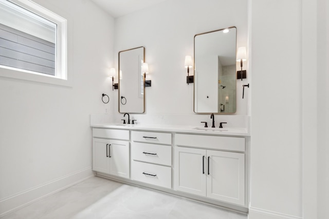 bathroom with vanity and a shower with shower door