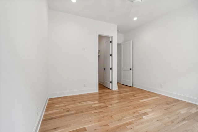 spare room featuring light hardwood / wood-style flooring