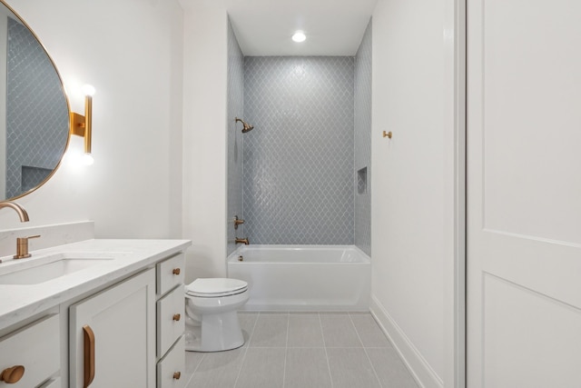 full bathroom with tiled shower / bath, vanity, toilet, and tile patterned flooring