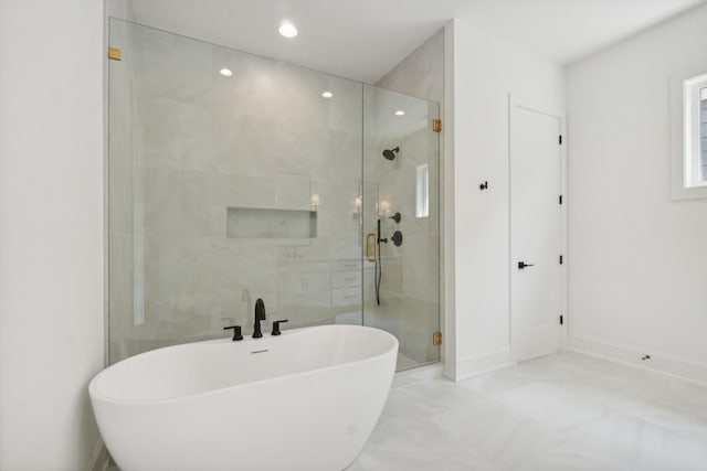 bathroom with separate shower and tub