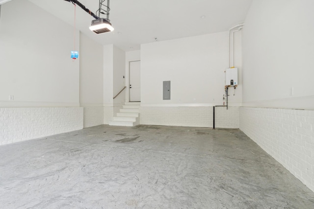 garage featuring a garage door opener and electric panel