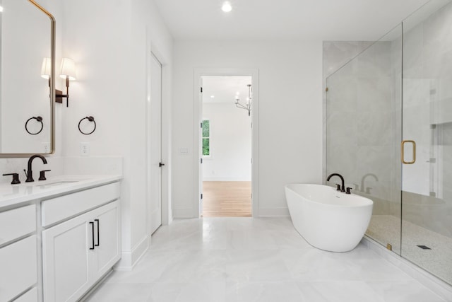 bathroom featuring vanity and shower with separate bathtub