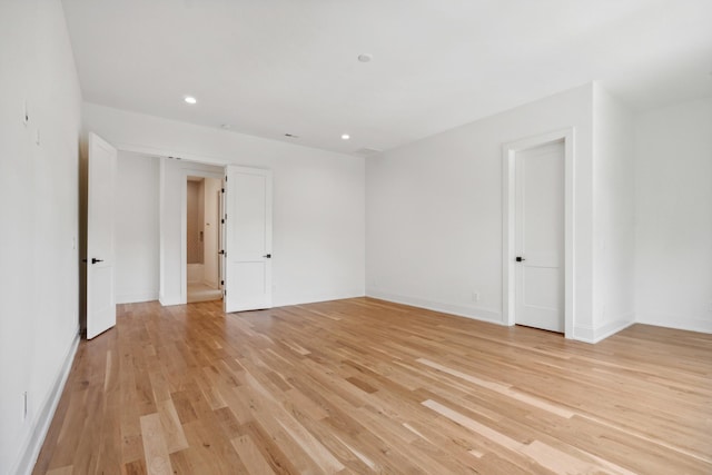 spare room with light wood-type flooring