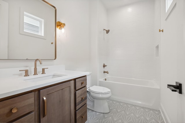 full bathroom featuring tile patterned flooring, tiled shower / bath, vanity, and toilet