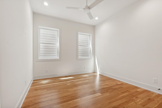 spare room featuring ceiling fan and light wood-type flooring