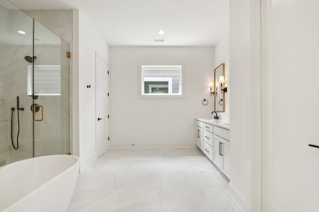 bathroom with vanity and separate shower and tub