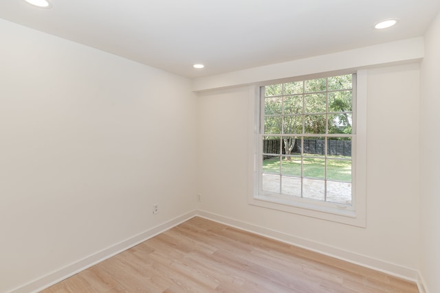 empty room featuring light hardwood / wood-style flooring and plenty of natural light