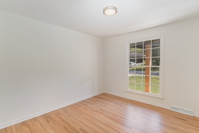 unfurnished room featuring light hardwood / wood-style flooring