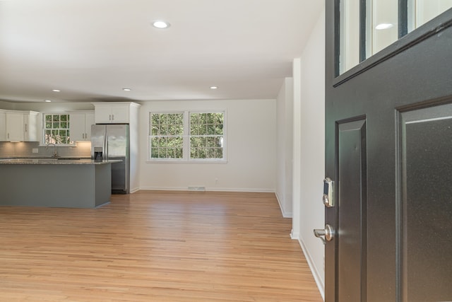 interior space with sink and light hardwood / wood-style floors