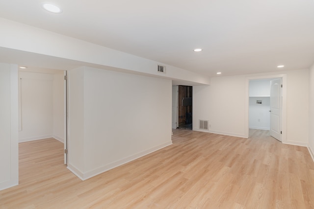 spare room featuring light hardwood / wood-style floors