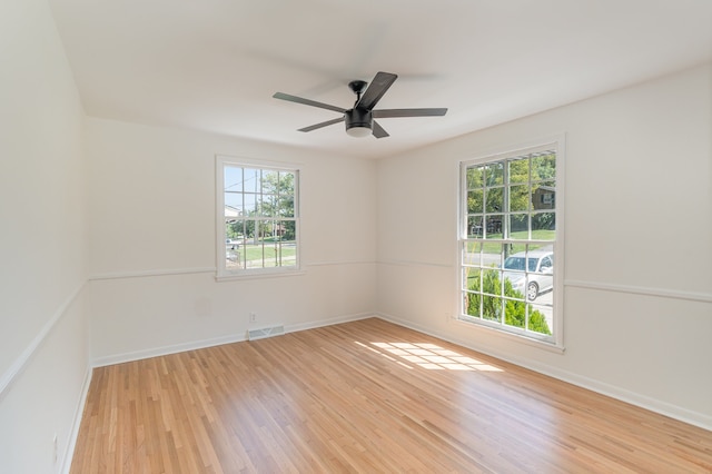 spare room featuring ceiling fan and light wood-type flooring