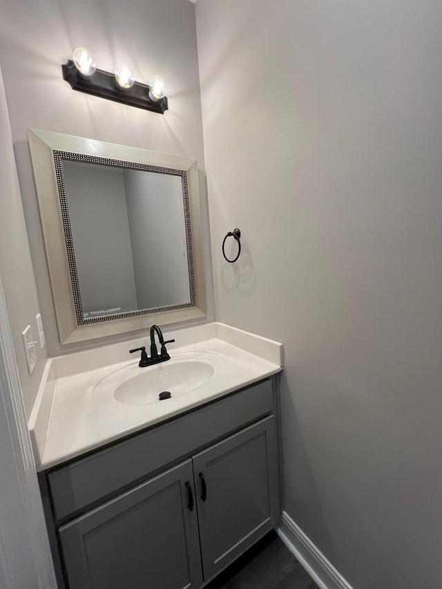 bathroom featuring baseboards and vanity