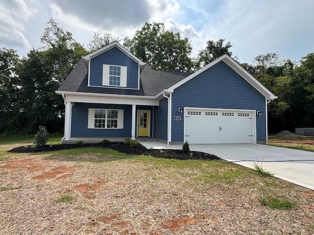 view of front of property with a garage and a porch