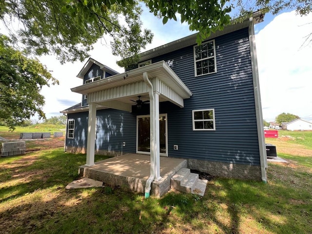 rear view of house with a patio area, a lawn, central AC, and ceiling fan