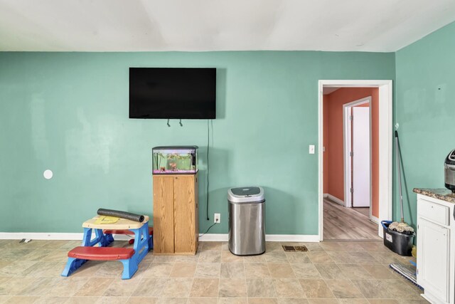 interior space featuring light tile patterned floors