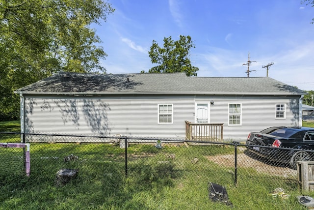 view of side of home featuring a lawn