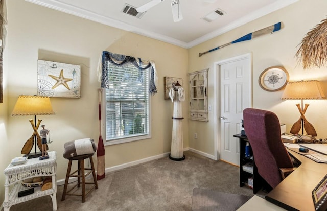 carpeted office with ornamental molding, visible vents, baseboards, and a ceiling fan