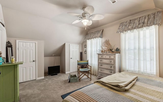 bedroom with carpet floors, lofted ceiling, visible vents, ceiling fan, and baseboards