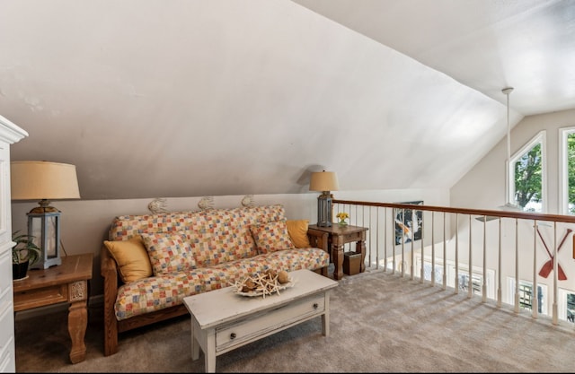 living room with lofted ceiling and carpet floors