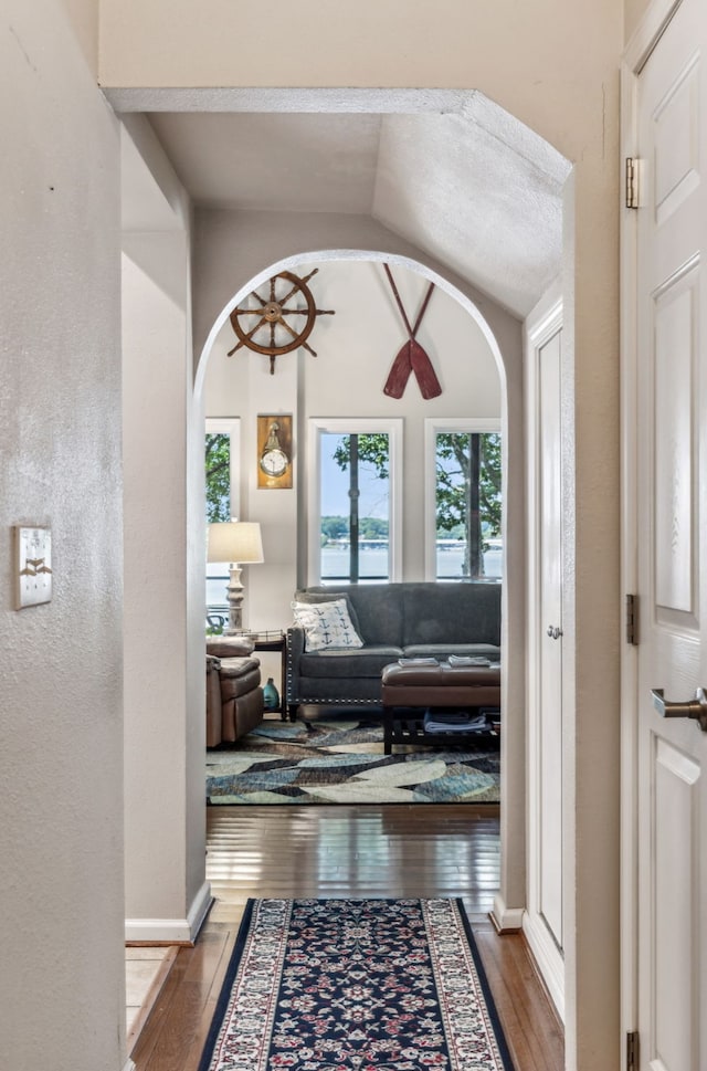 interior space with lofted ceiling and hardwood / wood-style flooring