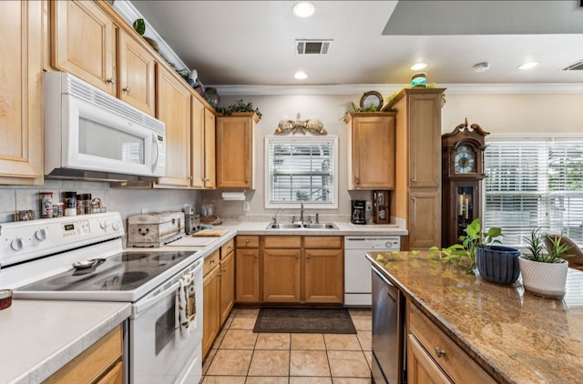 kitchen with light tile patterned flooring, crown molding, white appliances, and sink