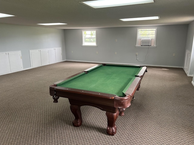 playroom featuring cooling unit, a textured ceiling, and carpet