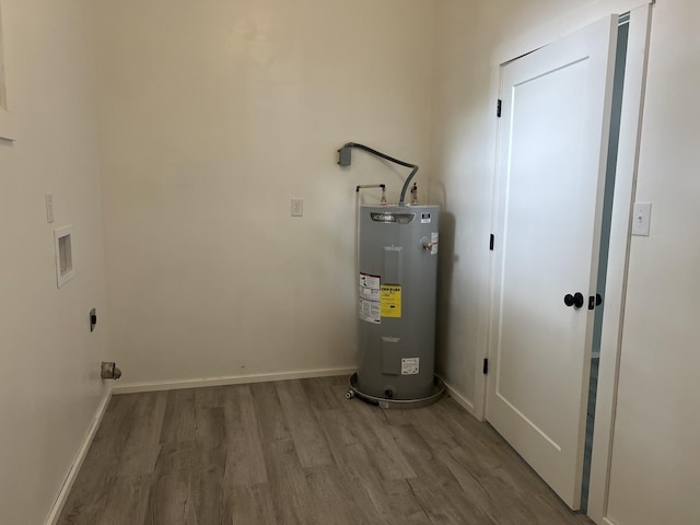 utility room featuring electric water heater