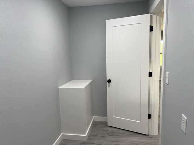 corridor featuring hardwood / wood-style flooring