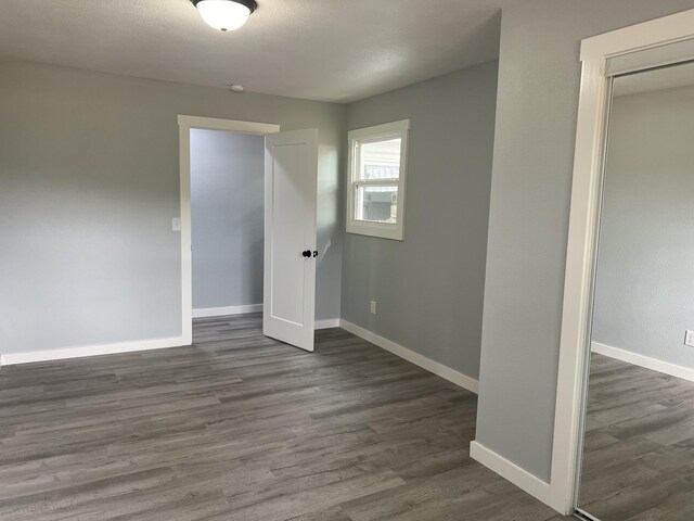 empty room with wood-type flooring