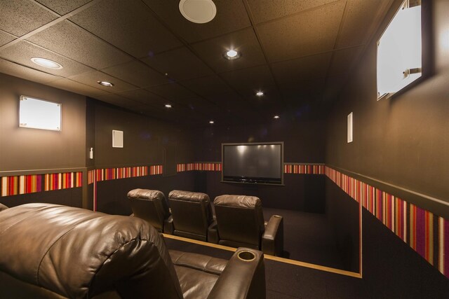 home theater with a paneled ceiling