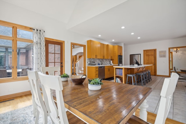 dining space with light wood-type flooring