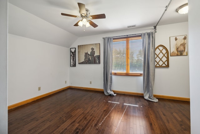 spare room with lofted ceiling, hardwood / wood-style flooring, and ceiling fan