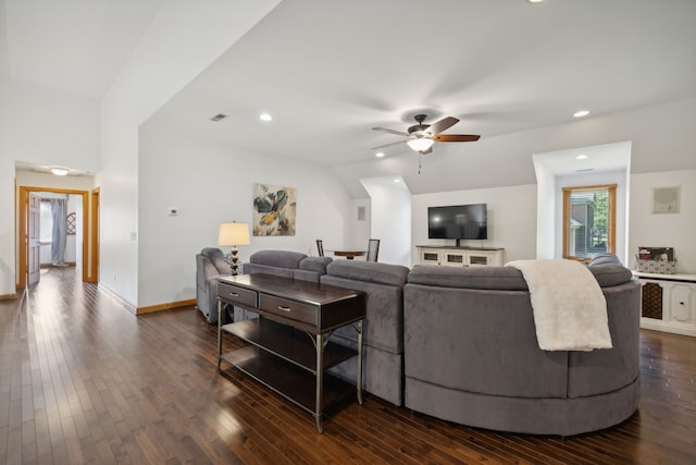 living room featuring lofted ceiling, dark hardwood / wood-style floors, and ceiling fan