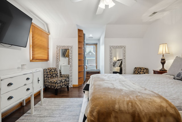 bedroom featuring lofted ceiling, dark hardwood / wood-style flooring, and ceiling fan