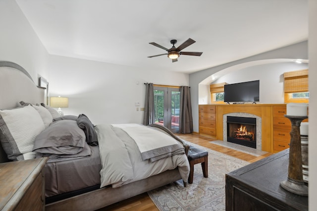 bedroom with ceiling fan and light hardwood / wood-style flooring