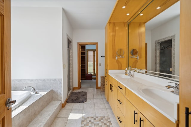 bathroom featuring double sink vanity, tile patterned flooring, and independent shower and bath