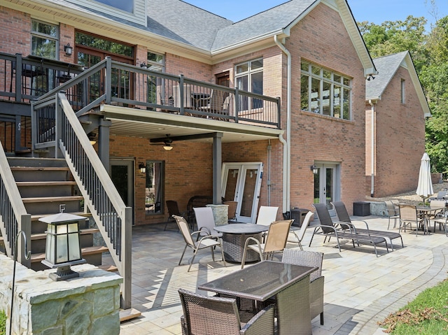 back of property with ceiling fan, french doors, and a patio area