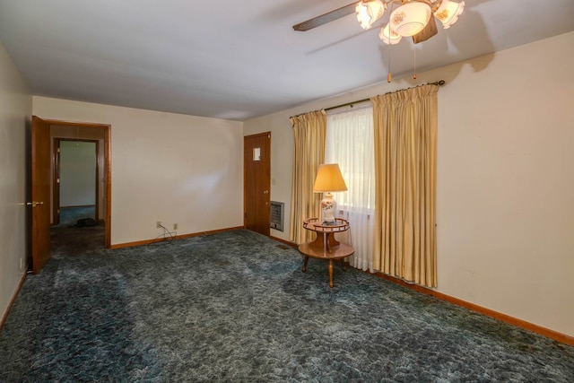 carpeted spare room with ceiling fan