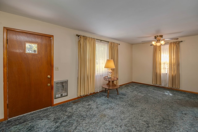 carpeted foyer with ceiling fan