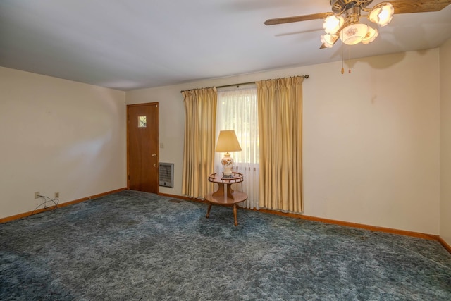 spare room with carpet flooring and ceiling fan