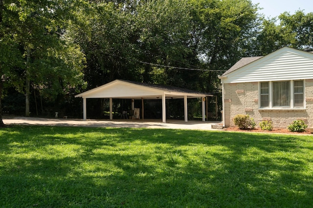 exterior space featuring a carport and a lawn