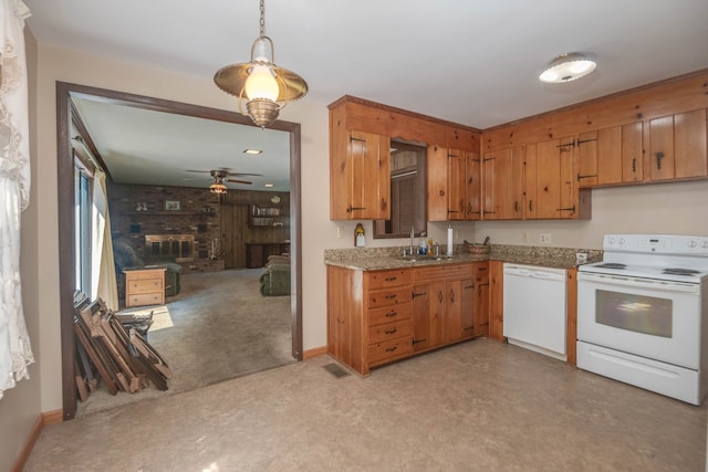 kitchen featuring ceiling fan, white appliances, sink, and hanging light fixtures