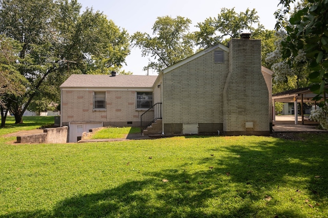 rear view of house with a lawn