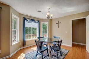 dining area with a chandelier and light hardwood / wood-style floors